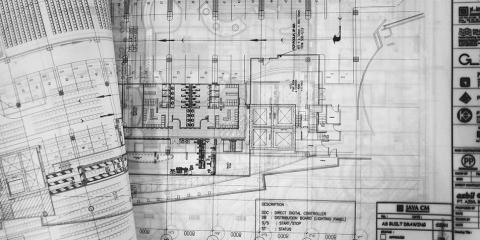 Black and white building construction drawings.